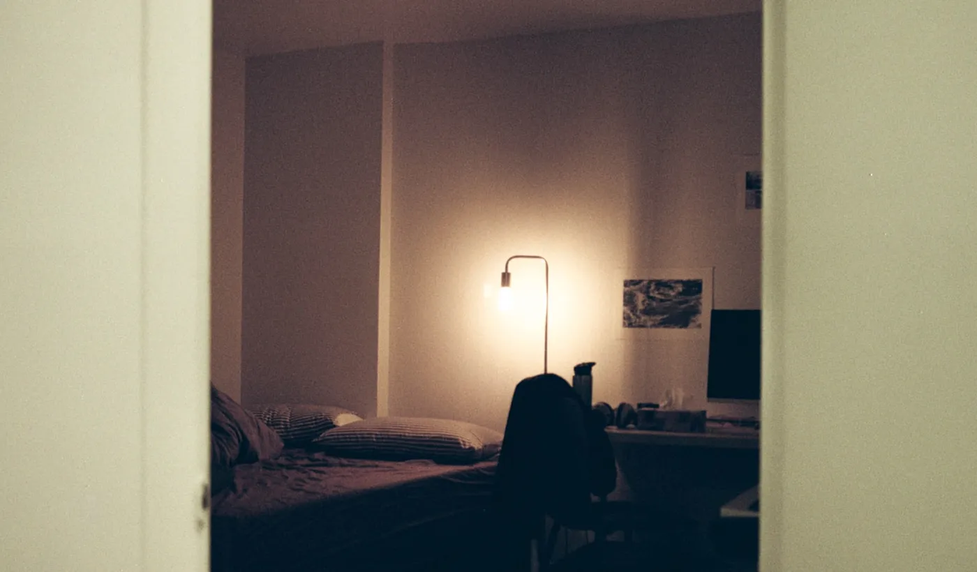 Person resting with their head down in a quiet room