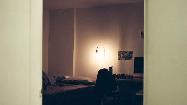 Person resting with their head down in a quiet room