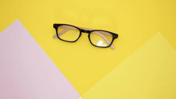 Black framed eyeglasses representing assessment of retinal migraine and one-eye visual symptoms