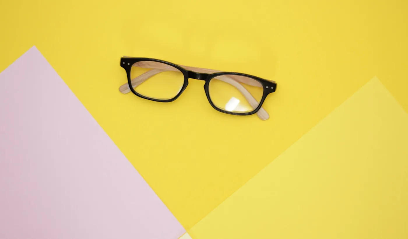 Black framed eyeglasses representing assessment of retinal migraine and one-eye visual symptoms